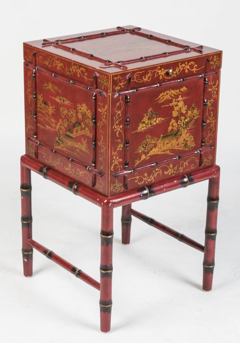 Asian Red Painted Box on Stand: Lift top square box the chinoiserie decoration on red painted ground, on a separated faux bamboo table base. Height 29 inches, 15 inches square. Notice to bidders: Condition reports and additional pho