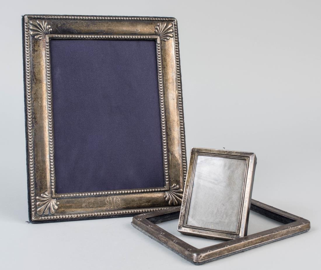 Three Silver Picture Frame: Two English picture frames and a small Lunt sterling silver picture frame. Lunt frame holds 2 3/4 x 2 inches. Notice to bidders: Condition reports and additional photographs are provided by request as