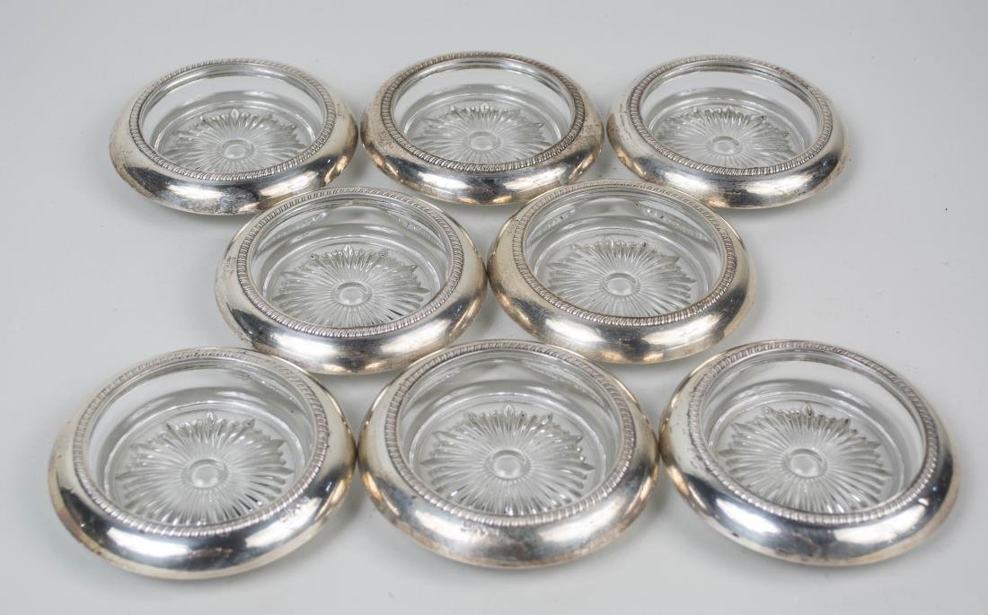 Set of Eight Saben Sterling Silver Coasters: Circular with gadrooned border decoration. Diameter 4 inches. Notice to bidders: Condition reports and additional photographs are provided by request as a courtesy to our clients, as such any conditio