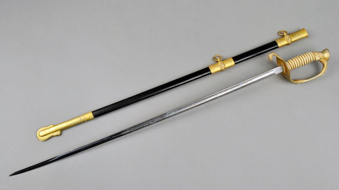 U.S. Navy Ceremonial Sword: 20th Century, German steel blade with etched decoration, shagreen handle and leather scabbard with brass mounts. Blade length 29 1/2 inches. Notice to bidders: Condition reports and additional photogr