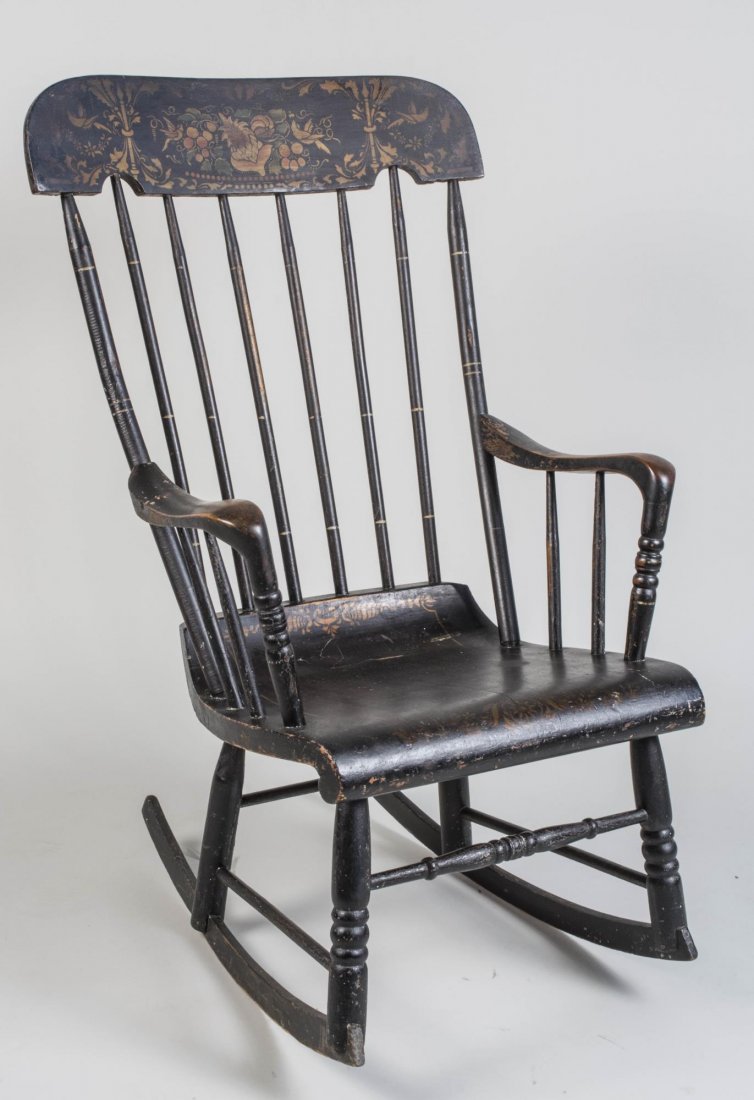 Vintage Painted Rocker: Table crest rail with stenciled decoration of flowers, spindle back and panel seat. Height 40 inches, width 24 inches, depth 28 inches. Notice to bidders: Condition reports and additional photographs 