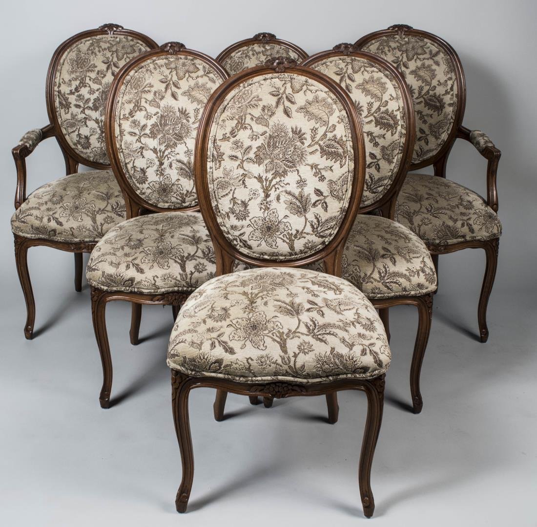 Dining Table and Set of Six Chairs: Table with circular top and two additional leaves, on a quatrepartite base with four scrolled acanthus leaf capped legs; together with a set of six oval back chairs, including two armchairs and four s