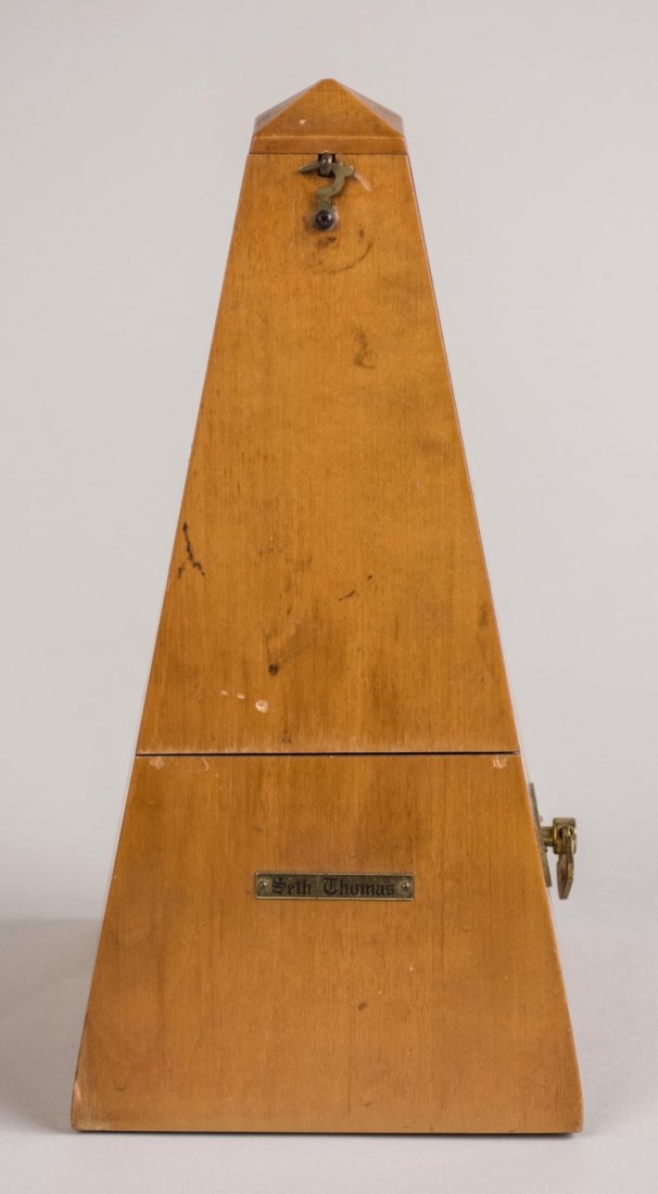 Seth Thomas Metronome: Height 8 3/4 inches. Notice to bidders: Condition reports and additional photographs are provided by request as a courtesy to our clients, as such any condition report is only an opinion and should no