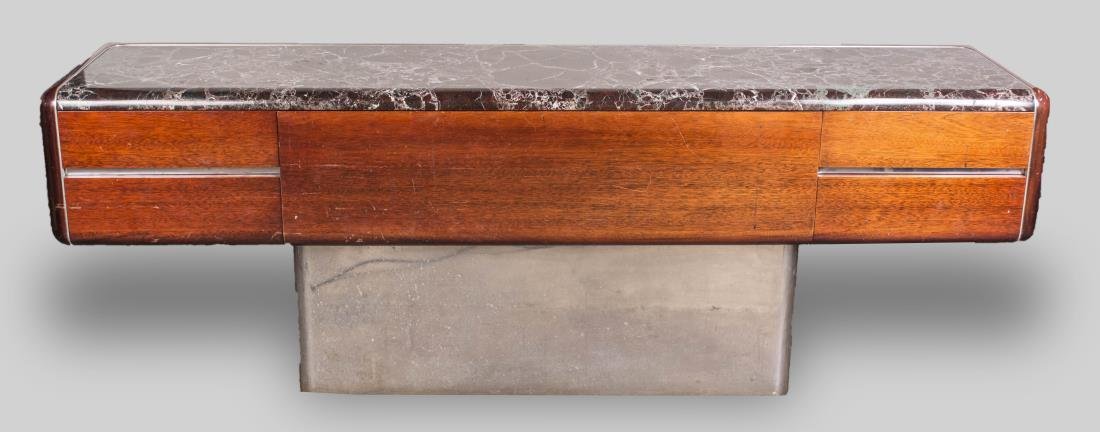 Vladimir Kagan Marble Top Credenza: Metal label in drawer, rectangular marble top over four short drawers on a brushed metal pedestal base. Height 29 inches, width 84 inches, depth 19 inches. Notice to bidders: Condition reports and add