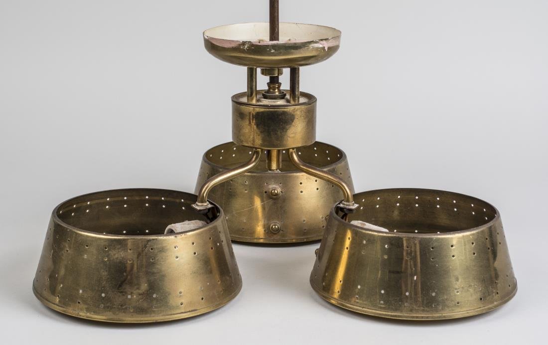 Tommi Parzinger Brass Chandelier: Three lights, stamped and labeled made in Cuba. Height 18 inches, width 17 inches. Notice to bidders: Condition reports and additional photographs are provided by request as a courtesy to our clients,