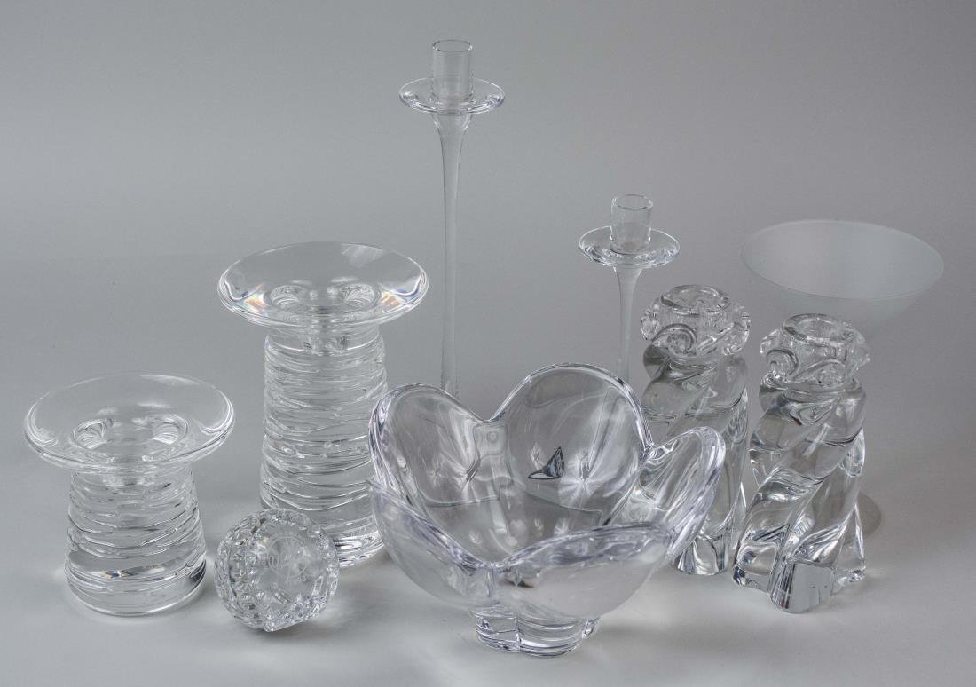 Group of Crystal Decorations: Including a pair of Baccarat candlesticks, two Steuben candlesticks, two Orrefors candlesticks, an Orrefors bowl, etc. Tallest height 11 inches. Notice to bidders: Condition reports and additional pho