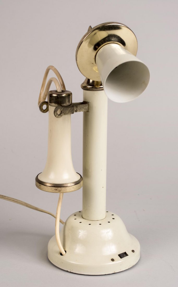 Vintage Phone Table Lamp: Design based on a vintage telephone, with a light in the mouthpiece. Height 11 1/2 inches. Notice to bidders: Condition reports and additional photographs are provided by request as a courtesy to our