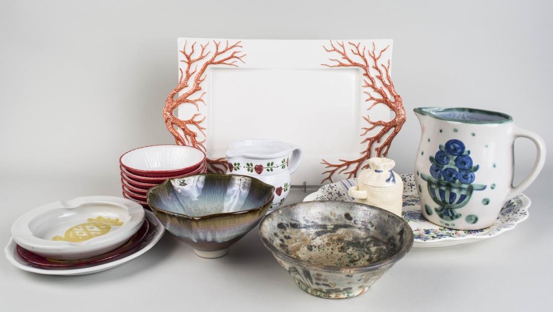 Group of Pottery Table Decorations: Approximately sixteen pieces, including pitchers, plates, bowls, trays, etc. Largest tray 12 x 19 3/4 inches. Notice to bidders: Condition reports and additional photographs are provided by request as