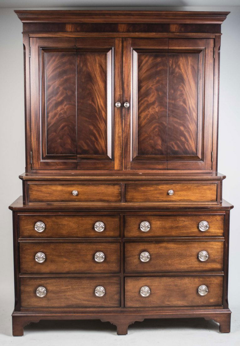 Ethan Allen Entertainment Cabinet: In the form of a Georgian linen press. Height 84 inches, width 58 inches, depth 20 inches. Notice to bidders: Condition reports and additional photographs are provided by request as a courtesy to our
