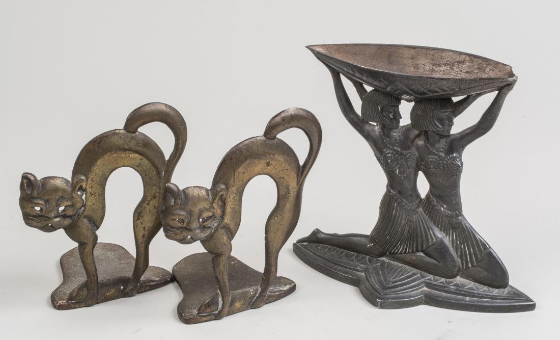 Group of Metal Decorations: Comprising a French Vantines Art Deco Egyptian Revival metal incense burner, height 5 3/4 inches, together with a pair of Halloween cat book ends, height 5 inches. Notice to bidders: Condition reports
