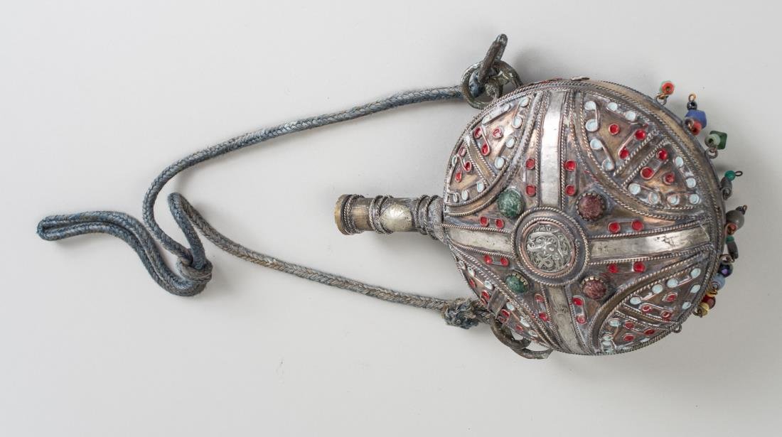 Middle Eastern Metal Canteen: Mixed metal, with enamel, hardstone, scroll, bead and calligraphy decoration. Height 10 inches. Notice to bidders: Condition reports and additional photographs are provided by request as a courtesy to