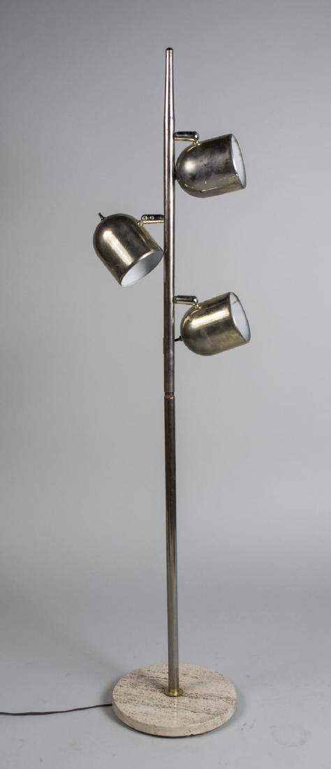 Attr. to Tommi Parzinger Three Light Floor Lamp: Three brass finished adjustable shades on a chrome tapered columnar support, on a round travertine marble base. Height 60 inches. Notice to bidders: Condition reports and additional photographs are pr
