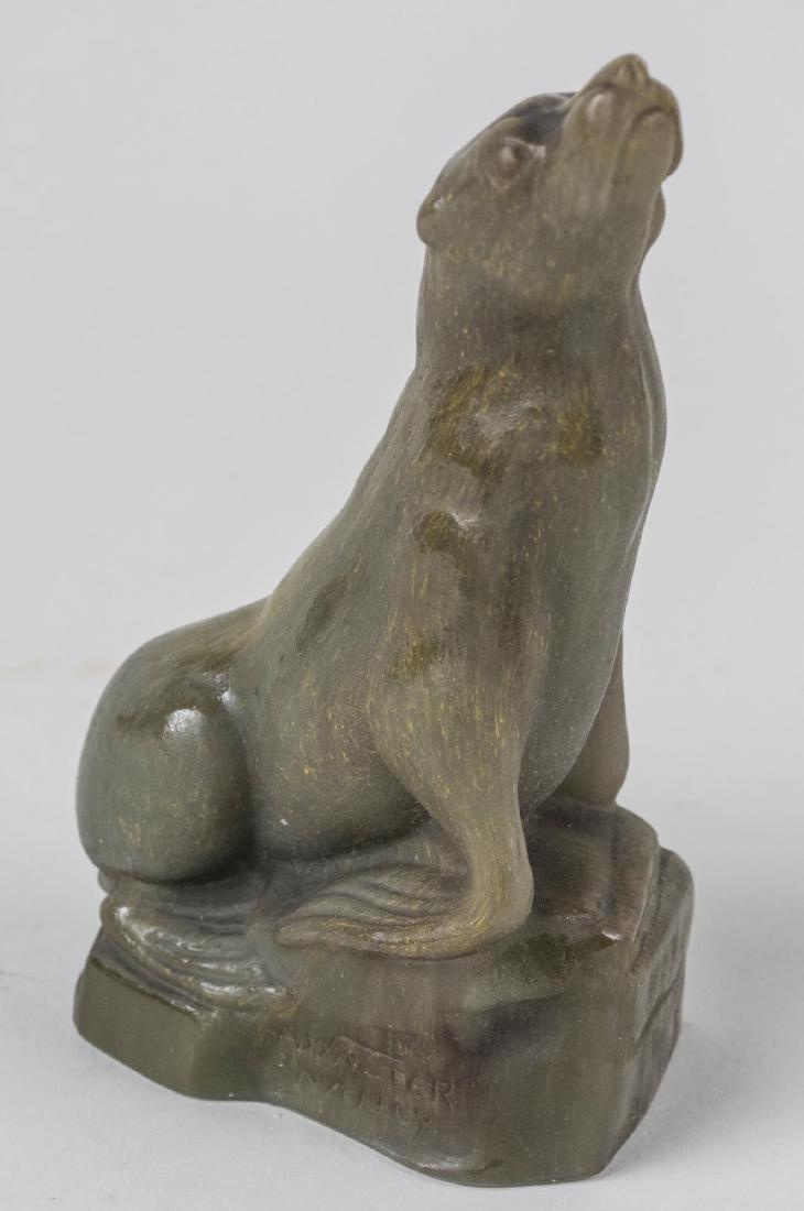 A Walter, Nancy Pate de Verre Sea Lion: Figure of an alert sea lion pate-de-verre glass with excellent semi transparent colour and fine hand finished surface detail modelled with head high on a naturalistic base, signed. Height 6 1/2 inches