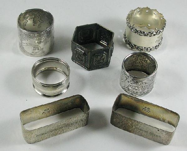 Seven sterling silver napkin rings: of various sizes and shapes; one with Cow Jumped Over The Moon & The Dish Ran Away With The Spoon and The Cat And The Fiddle; and another: Little Boy Blue and The Sheep's In The Meadow - Cows In The C