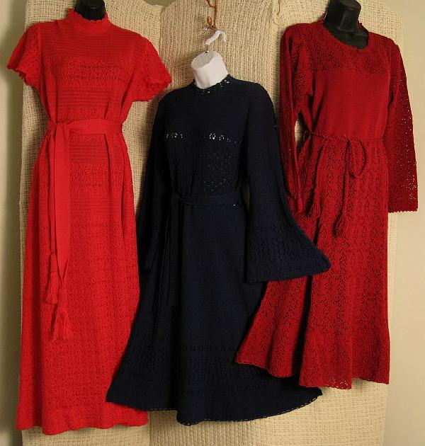 Lot 1970's Fine Knit/Crocheted Dresses: Navy boot length knit dress, 6 panel flared skirt, with exaggerated bell sleeves, openwork crochet bodice, cuffs and hemline, self belt, back zip. Miss Joan cherry red boot length dress, four panel sk