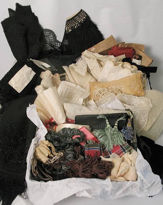 Lot Antique/Victorian Fancy Laces & Trims: Yardage of black silk fringe, plush velvet net trim (with note describing it as from Mantilla). Remnants of 19th C cretonne fabric. 12 yards of 12" deep net lace, 8" wide eye skirt borders , silk ribb