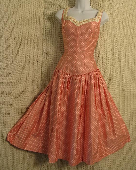 1960's Pink Polka Dot Sundress: Best & Co Pink/White polka dot 60's sundress in polished cotton, dropped waist, full skirt, back bow,, white chintz borders w daisy applique. W 28" Bust 32/34" Cond: Fresh, VG (one daisy missing)