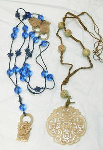 Pierced & Carved Celedon Chinese Jade Necklaces/p: Intricate carving connects unique reticulated and hinged jade interlocking pieces. The triple links are spaced between hand knotted silk and blue art glass beads with a pendant. (L 44 ") Cond: EXC. Ne