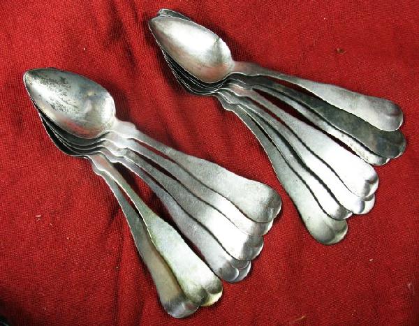 Thirteen coin silver teaspoons: nine are maked FARRINGTON & HUNNEWELL, two are N. HARDING & CO., and two are marked JOSIA GOODING and another maker.