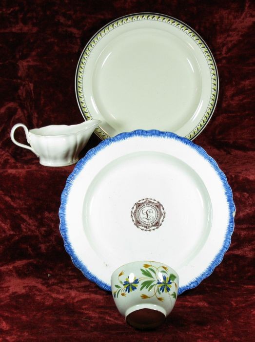 Four pieces of creamware: including: sauce boat, ca. 1790; Wedgwood plate brown, ochre & black border, ca. 1790; armorial dinner plate with blue feather-edged with sepia monogram in center, ca. 1790 (crack, chip on border); te