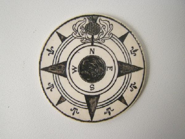 Carved whalebone compass dial: decorative fleur 'd lis along the border and thistle carved above the north point "marked on reserve Wickes- for the wickes house Newport, RI M.F.A. Boston 2 1/4"