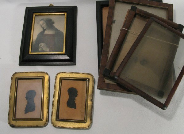 Seven picture frames: including five wooden frames and two brass frames with early 19th century silhouettes.