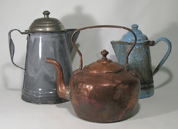 A teapot and two coffeepots: two granite-ware coffeepots and an early copper tea kettle (repairs to spout, dents).