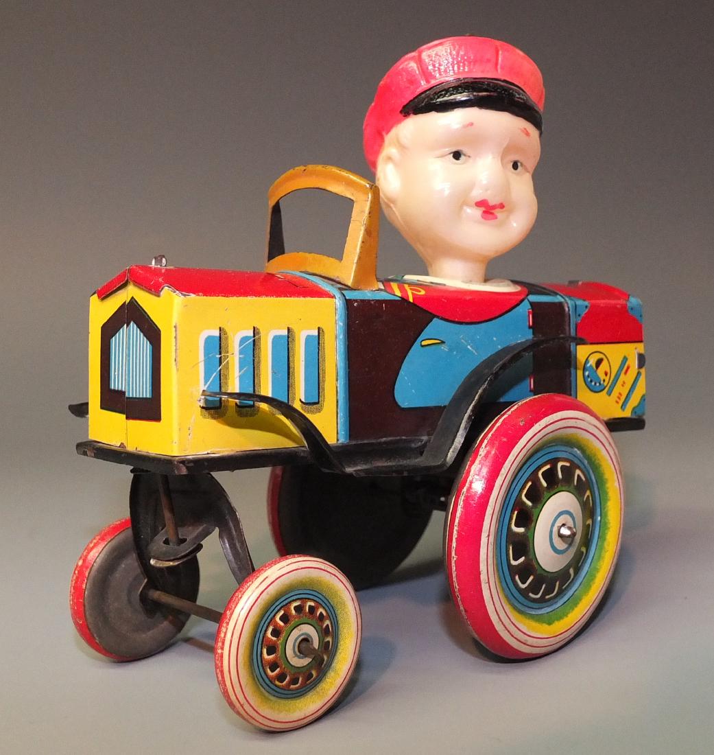 KURAMOCHI CELLULOID & TIN WINDUP JOKE CAR (1 of 7)