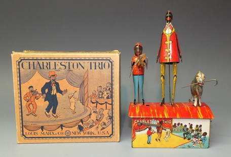 MARX CHARLESTON TRIO WINDUP TOY & BOX: Made in USA by Marx. All Original & Complete Early Black Americana Tin Windup Toy Depicting Boy Playing Violin, Man Dancing & Dog on Roof of Litho House in the Original Box. 1920's 5.5" W x 8.5" H