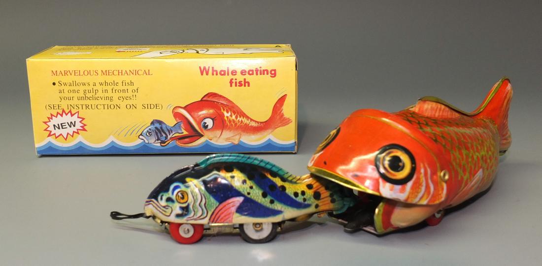 WHALE EATING FISH TIN TOY & BOX: Made in China. Tin Litho Mechanical Action Large Fish Eating Smaller Fish. The Mechanical Action Works by Pulling the Smaller Fish Out of the Larger Fish's Mouth. Comes With the Original Box. 1960's 6