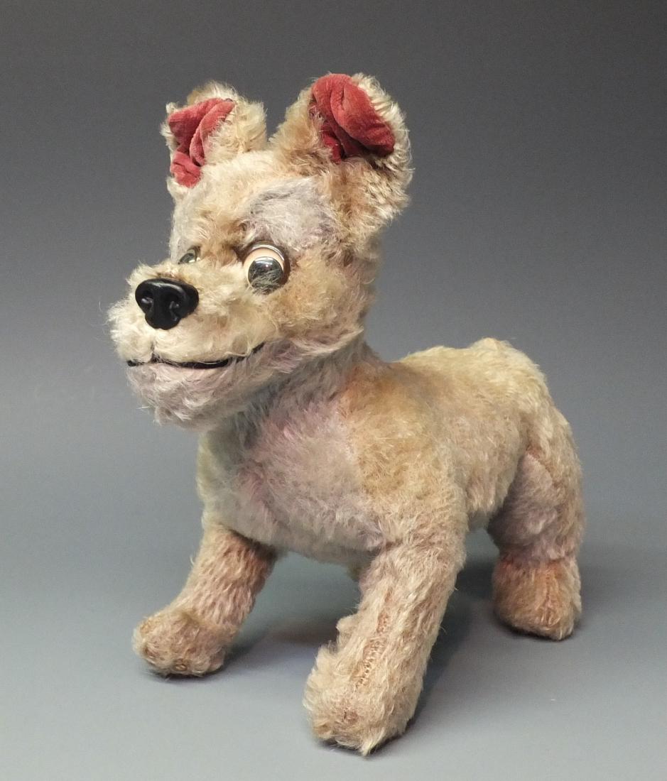 SCHUCO GERMAN BIGO BELLO TRAMP DOG: Made in Western Germany by Schuco. 1960's Mohair covered Tramp dog from Disney Lady & the Tramp. 9" long x 8.5" high.