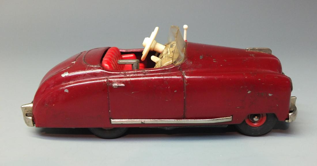 SCHUCO GERMAN 4012 RADIO TIN WIND UP CAR: Made in US Zone Germany by Schuco. 1950's tin windup 4012 Radio Car with Thorens music box, steering & hand brake. 6" long.