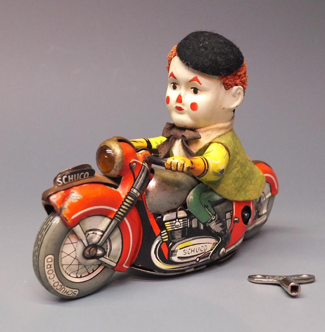 SCHUCO GERMAN 1007 MOTODRILL CLOWN TIN WIND UP (1 of 6)
