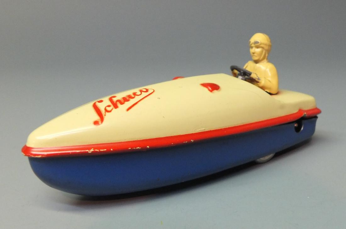 SCHUCO GERMAN 1015 MIRAKOBO TIN WIND UP SPEED BOAT: Made in Germany by Schuco. 1940's scarce & hard to find tin windup 1015 speed boat with non fall table top action. 5" long.