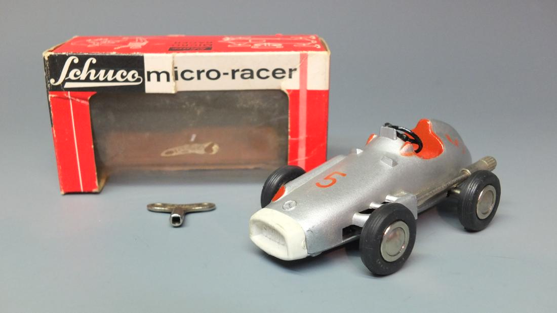 SCHUCO GERMAN 1043 MERCEDES 2,5 L WIND UP MICRO RACER &: Made in Western Germany by Schuco. Scarce & hard to find 1950's steerable windup 1043 Mercedes 2.5 l car micro racer. Comes with key & original box. 4" long.