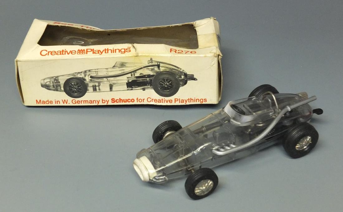 SCHUCO 1005 CLEAR BODY WINDUP MICRO RACER & BOX: Made in Germany by Schuco for Creative Playthings. 1950's steerable wind up 1005 micro racer car with clear body in the original box. 5.5" long.