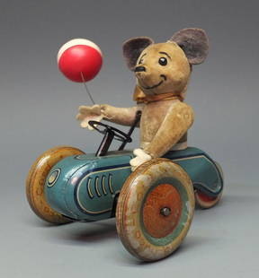 SCHUCO 853 MOUSE TRICYCLE SCOOTER WINDUP: Made in Germany by Schuco. Rare & hard to find 1933 tin wind up 853 Mouse Riding Tricycle Scooter with original celluloid balloon and attached key. This is the largest version of all of the Schuco