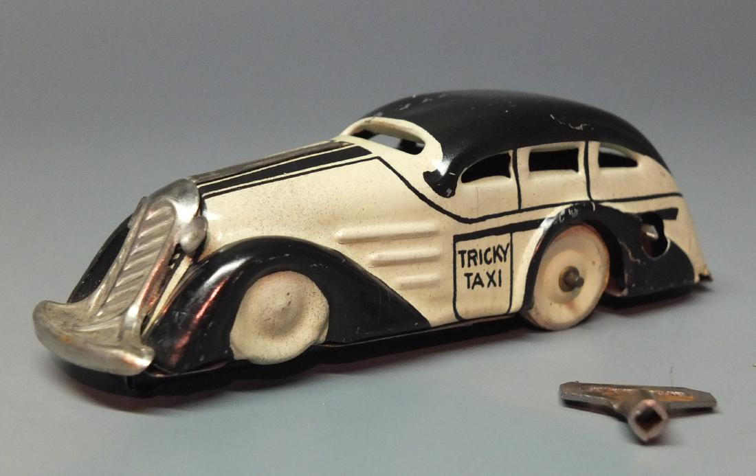 MARX TRICKY TAXI TIN WINDUP CAR (1 of 7)