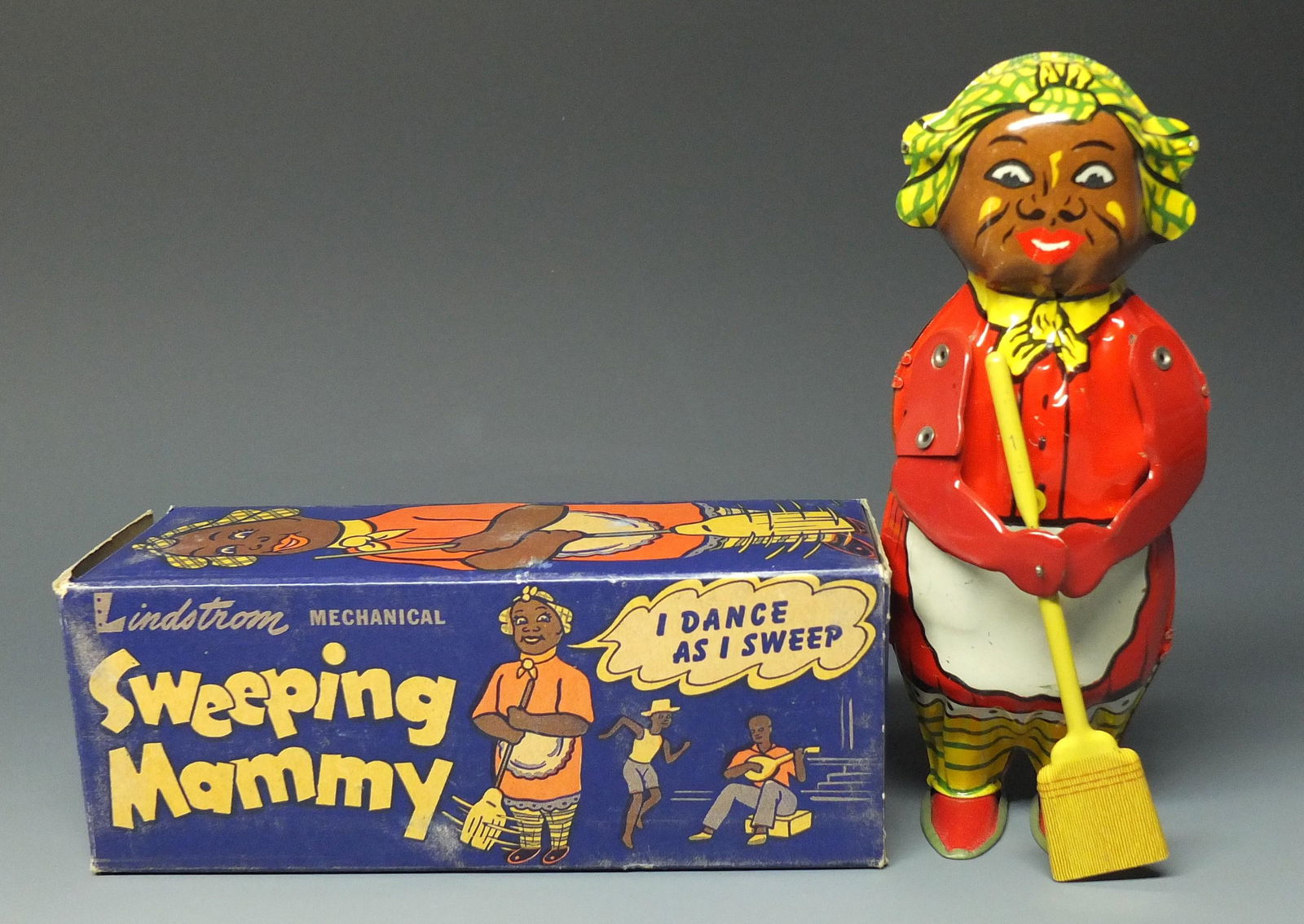 LINDSTROM SWEEPING MAMMY TIN WINDUP & BOX: Made in USA by Lindstrom. Scarce Early 1940's Colorfully Lithographed Mechanical Wind Up Toy in Original Box. Old Store Stock. 8" H