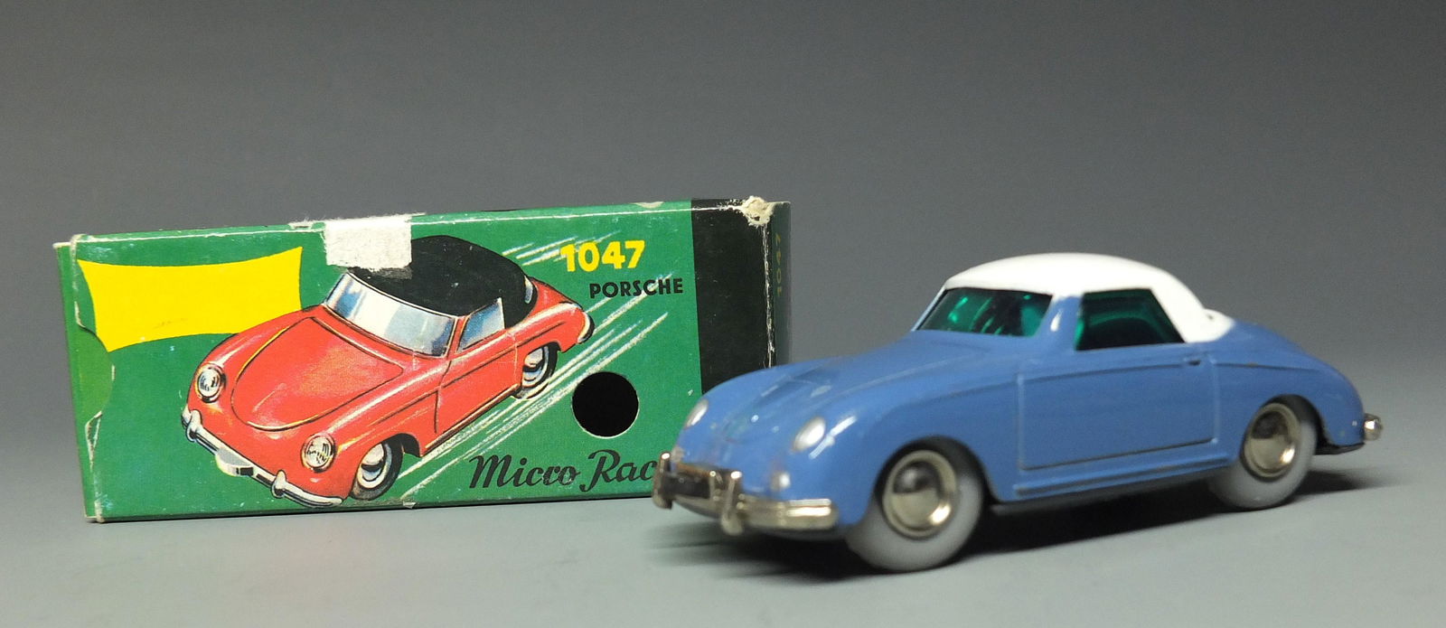 SCHUCO NUTZ 1047 PORSCHE WINDUP MICRO RACER & BOX: Made in Western Germany by Schuco. 1950's steerable windup 1044 Mercedes 190 sl micro racer. Reproduced by Werner Schuco Nutz(former employee that designed the Micro Racer) using the original tools 4"