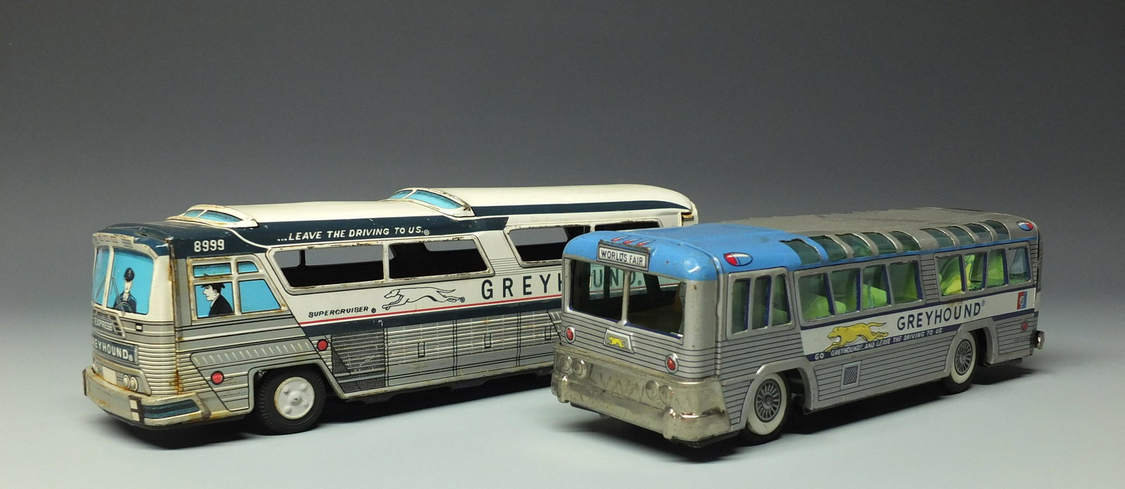 2 TIN FRICTION GREYHOUND BUSES: Made in Japan. Lot of 2 Highly Detailed Tin Litho Friction Buses. Supercruiser is Not Working, Other Bus is Working. Both Missing Hub Caps. 9.25" & 11" L