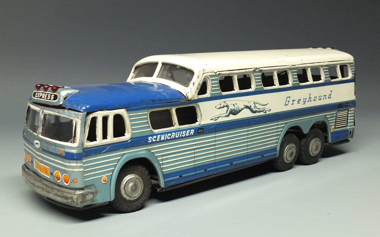 TIN BATTERY OP SCENICRUISER GREYHOUND BUS: Made in Japan by KTS. Rare Highly Detailed Tin Litho Battery Operated Version of this Scenicruiser Bus w/ Front & Rear Destination Lights. Bus Works, But Needs a Nudge To Get it Going. 14" L