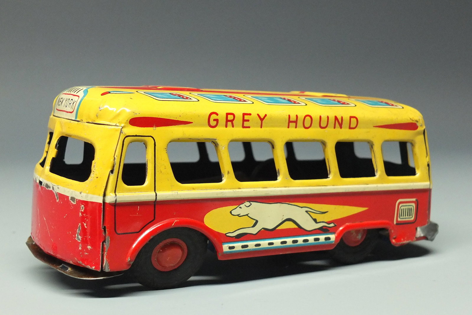 DAIYA TIN FRICTION GREYHOUND BUS: Made in Japan by Daiya. Tin Litho Friction Bus w/ Colorful Lithography. 6" L