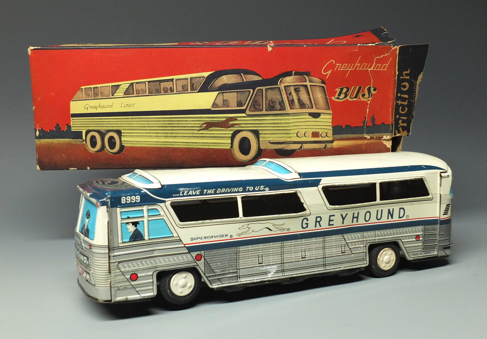 TIN FRICTION GREYHOUND BUS & BOX: Made in Japan. Highly Detailed Tin Litho Friction Supercruiser Bus & Original Box. Works, But Not Strong Enough to Propel Bus. 10.5" L