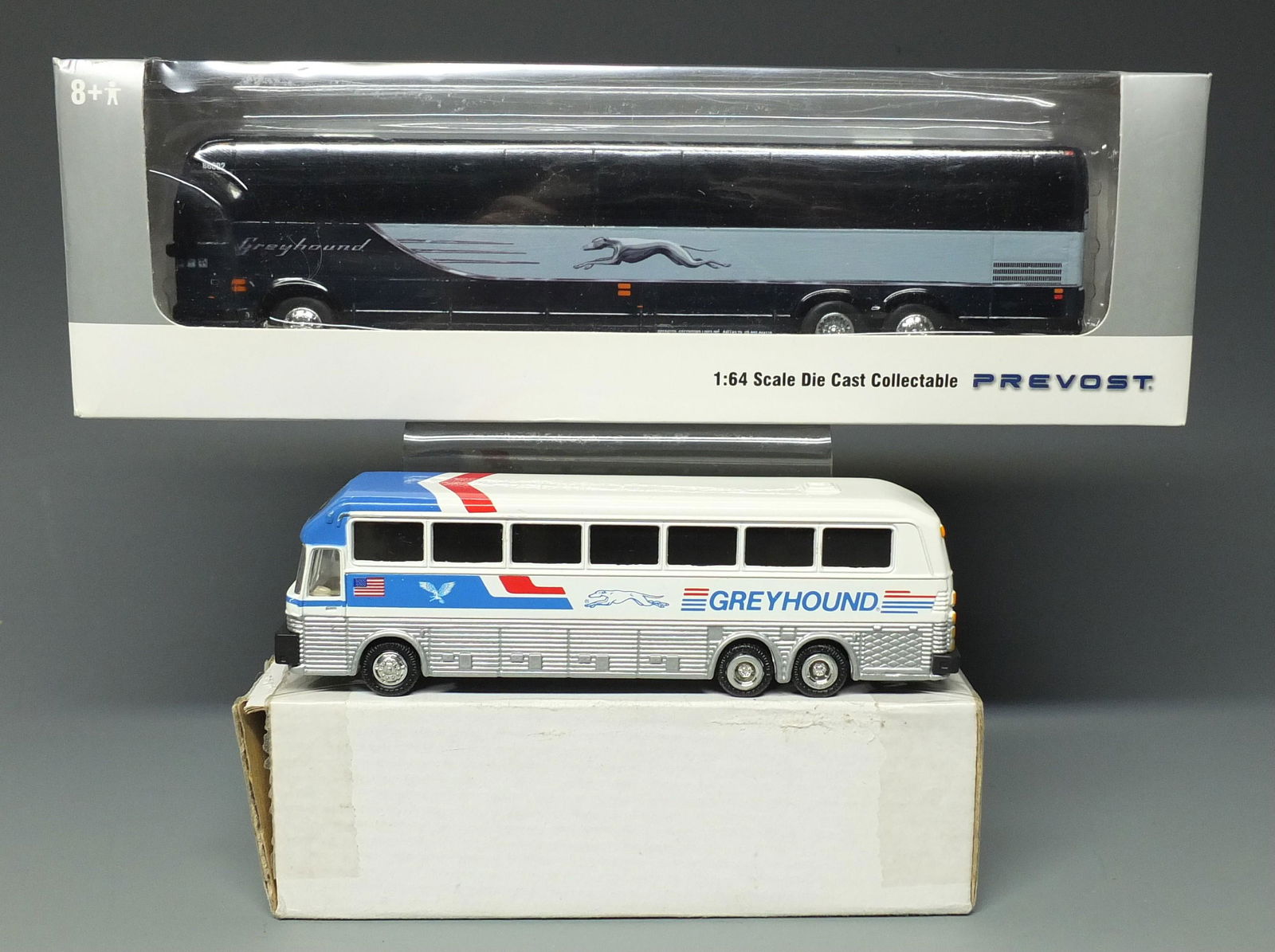 2 DIECAST GREYHOUND BUSES & BOXES: Lot of 2 Diecast Greyhound Buses w/Original Boxes Include: Prevost 1/64 Scale Bus & Box ( 8" L) and Road Champs Eagle Coach Bus & Box (5.5" L).
