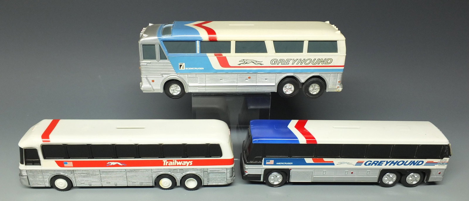 3 VINTAGE JIMSON BUS BANKS: Lot of 3 Plastic Vintage Bus Banks Includes: 2 Rare Jimson Buses (#220 Super 7 Scenicruiser & #200 Americruiser) and 1 Rare Go Big Red Trailways Bus. Approx. 10" L