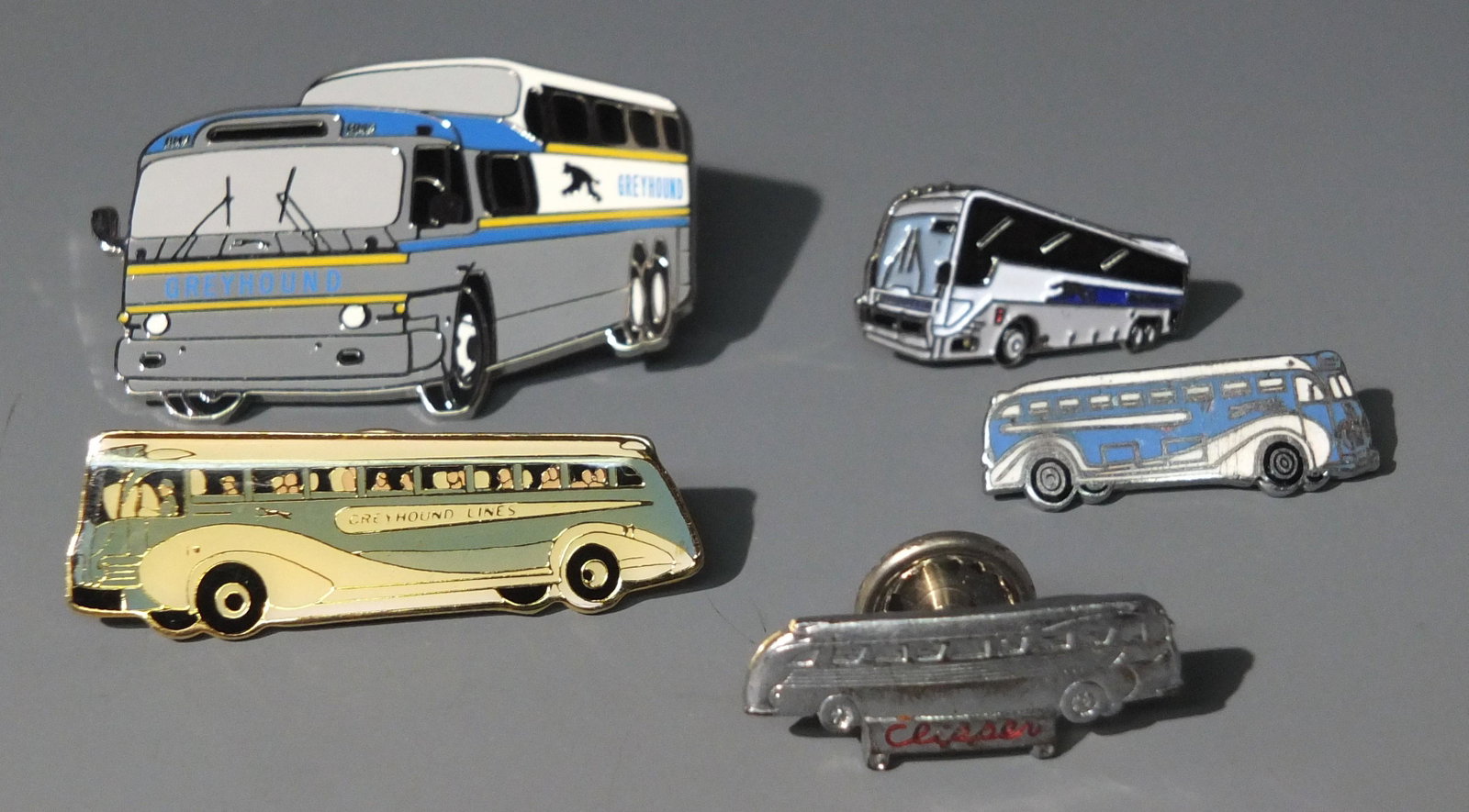 5 GREYHOUND BUS PINS ENAMELED: Lot of 5 Greyhound Bus Lapel Pins, Including 4 Enameled.