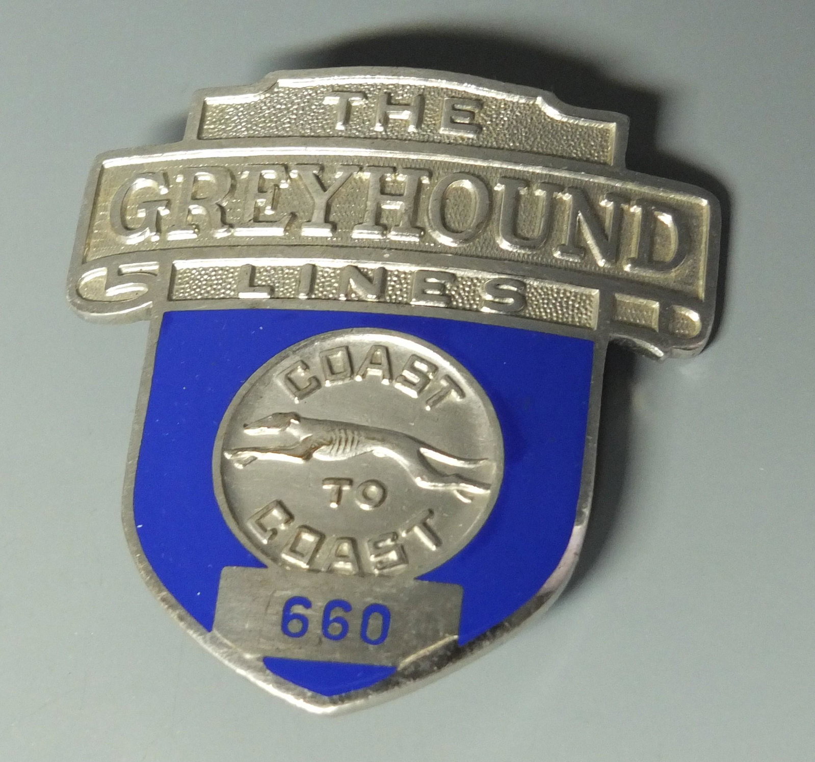 COAST TO COAST GREYHOUND UNIFORM HAT BADGE: Chrome & Enamel Coast to Coast Greyhound Bus Lines 660 Uniform Hat Badge. 2.5" H