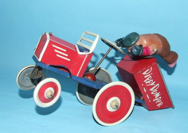 MARX BLUTO DIPPY DUMPER CELLULOID TIN WIND UP TOY: 1940. USA. Working. Complete. All Original. Celluloid figure has no cracks, breaks or dents. Only 2 versions of this scarce Popeye toy were made, 1 with Bluto and 1 with Popeye. 8.75" L x 5.75" H. (NM