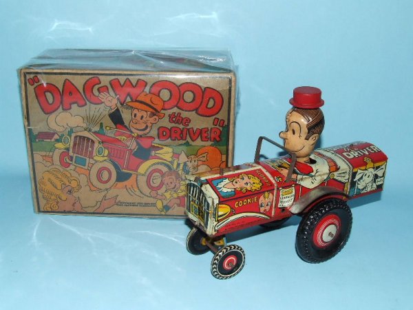 MARX DAGWOOD DRIVER TIN WIND UP TOY CAR & BOX: 1941. USA. Working. Complete. All Original including wood hat. Superb early comic strip character toy & largest of the eccentric cars produced. 8" L. (EX). OB One end is missing all flaps. Opposite en